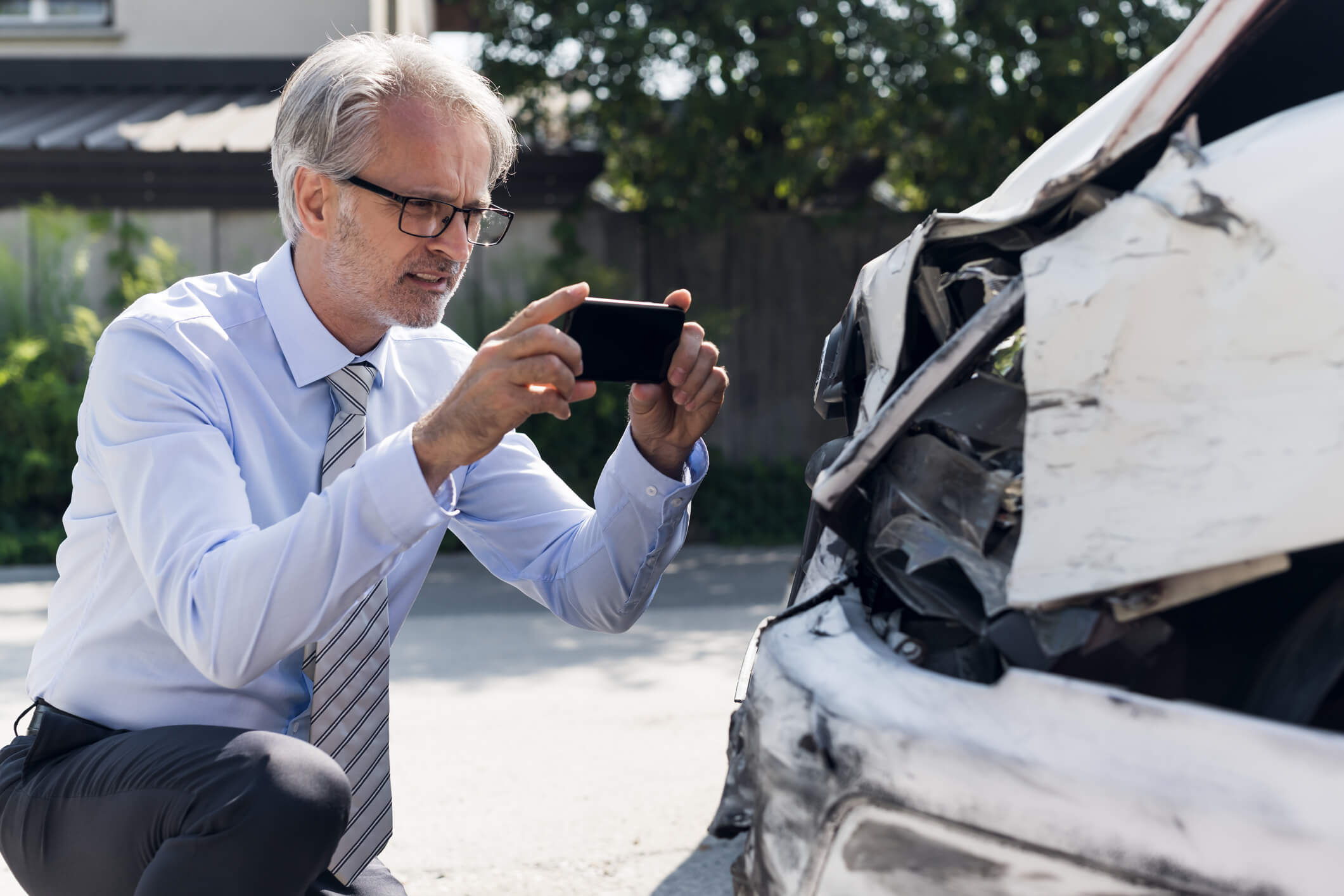 Adjuster using mini tort laws to examine car.