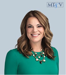Professional headshot of a smiling woman with shoulder-length brown hair, wearing a green blouse and layered necklace, against a light blue background. milea  Miller, Tischler & Vislosky, P.C. milea  Miller, Tischler & Vislosky, P.C.